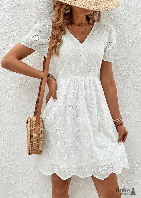 Vestido bohemio con escote en V, mangas abullonadas y espalda descubierta